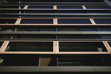 reflections in a facade of a modern building
