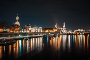 Fototapeta na wymiar Beautiful night view of the city and reflections in the Elbe river in Dresden, Germany