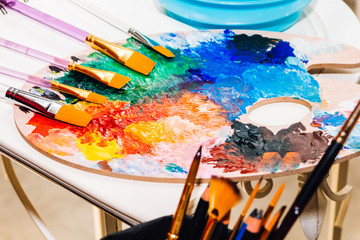 Set for drawing and art painting with color palette and watercolor paints on table