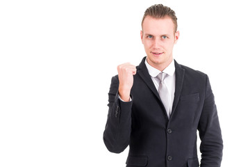 Successful businessman celebrating with arms up