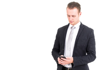 Businessman in elegant black suit using smartphone isolated on white background
