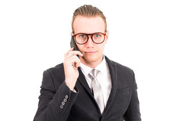 Businessman in elegant black suit using smartphone isolated on white background