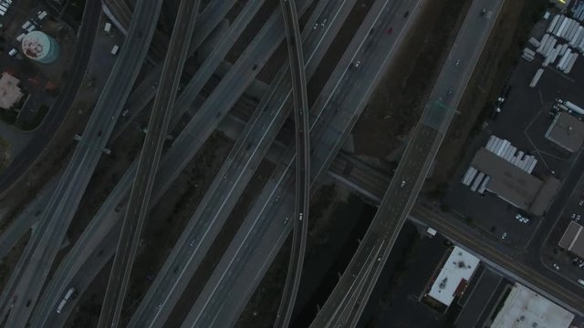 Aerial over a freeway on and off ramps.