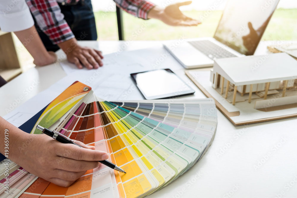 Poster two young women interior design or graphic designer working on project of architecture drawing with 