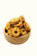 Closeup of cracker with pineapple jam on wooden cup