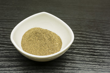 Ground black pepper in a bowl.