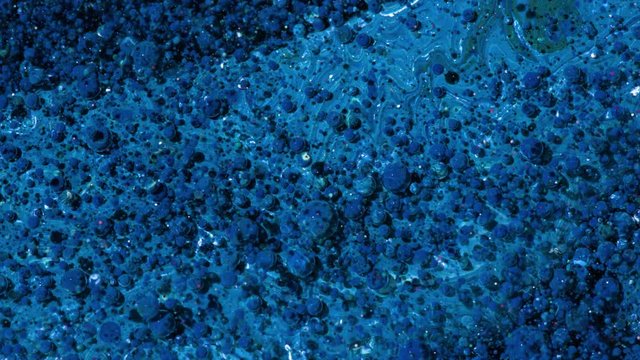 Top view Bright Collors Bubbles Slow Motion Oil Ink is fantastic structure of colorful chaotic motion bubbles stock video is a beautiful, unique, organic 4K clip.