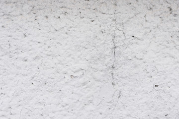 Wall fragment with scratches and cracks