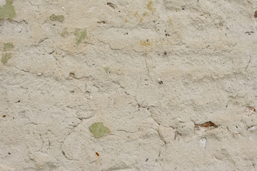 Wall fragment with scratches and cracks