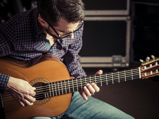 Guitarist playing acoustic guitar