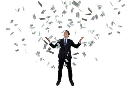 Young businessman With lots of money Based on success in business investment.