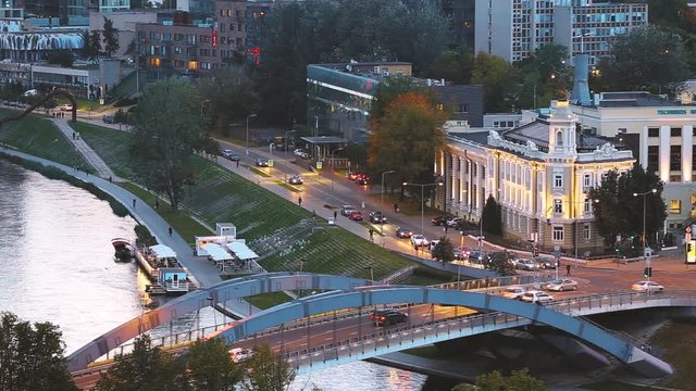 Vilnius, Lithuania. Top View Of Energy And Technology Museum And Traffic On Mindaugas Bridge Across Neris River In Evening Time
