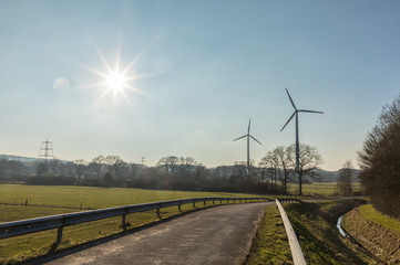 Fototapeta na wymiar wind turbine with sun