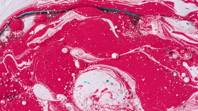 Top view Bright Collors Bubbles Slow Motion Oil Ink is fantastic structure of colorful chaotic motion bubbles stock video is a beautiful, unique, organic 4K clip.