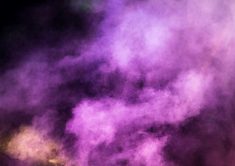 Multi-colored smoke at the concert at night