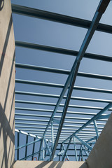 Obraz premium Structure of steel roof frame for building construction.