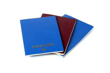 three passports of different colors, on white background