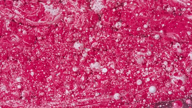 Top view Bright Collors Bubbles Slow Motion Oil Ink is fantastic structure of colorful chaotic motion bubbles stock video is a beautiful, unique, organic 4K clip.