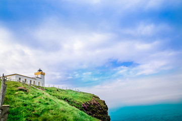 Fototapeta na wymiar View on lighthouse by Duncansby Head in Scotland