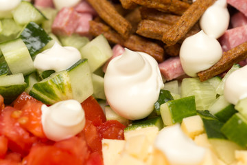 Mayonnaise on a salad on a table