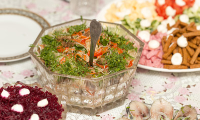 Dishes from salads with mayonnaise on the table