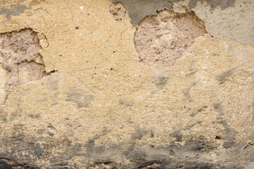 Wall fragment with scratches and cracks