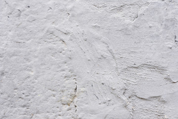 Wall fragment with scratches and cracks