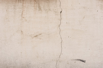 Wall fragment with scratches and cracks