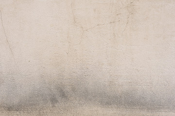 Wall fragment with scratches and cracks