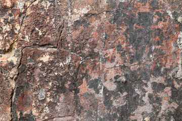 Wall fragment with scratches and cracks