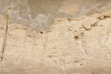 Wall fragment with scratches and cracks
