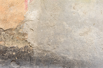 Wall fragment with scratches and cracks