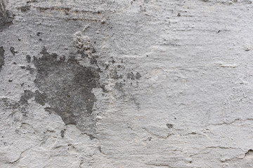 Wall fragment with scratches and cracks