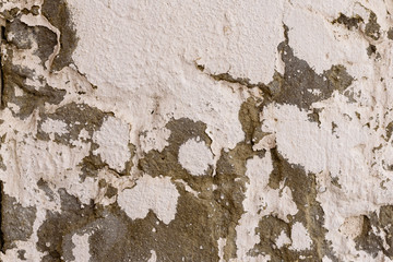 Wall fragment with scratches and cracks