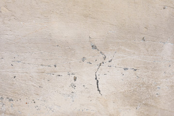 Wall fragment with scratches and cracks