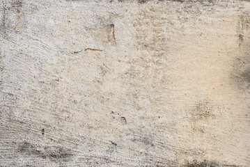 Wall fragment with scratches and cracks