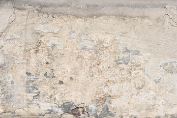 Wall fragment with scratches and cracks