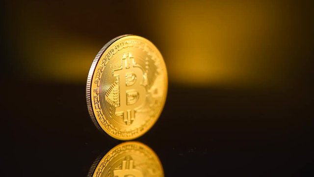 Bitcoin crypto currency. BTC coins on black background. Blockchain technology, Bitcoin mining concept