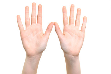 Caucasian white girl is showing her hands with open palms on a white background in close-up