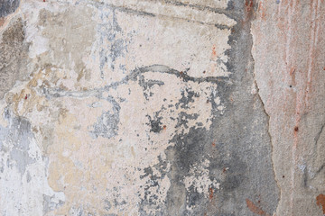 Wall fragment with scratches and cracks