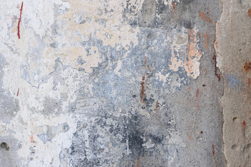 Wall fragment with scratches and cracks