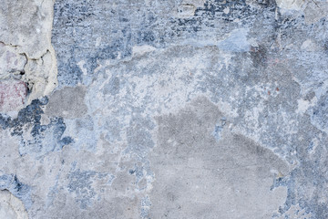 Wall fragment with scratches and cracks