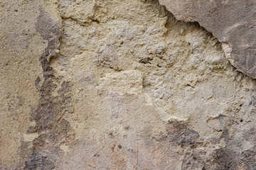 Wall fragment with scratches and cracks