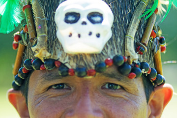 Portrait of a man wearing traditional Peruvian clothing and dancing Anaconda dance, a musical genre...