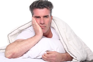 Obraz premium Man in the bedroom