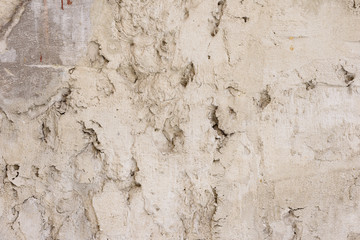 Wall fragment with scratches and cracks