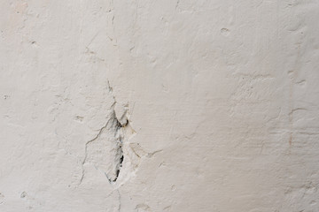 Wall fragment with scratches and cracks