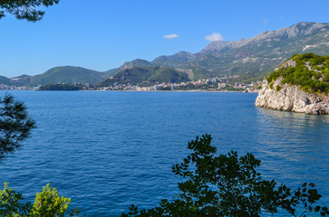 Fototapeta premium Beautiful sea view. The mountains descend into the sea. Blue sky and turquoise water. Adriatic Sea. Montenegro.