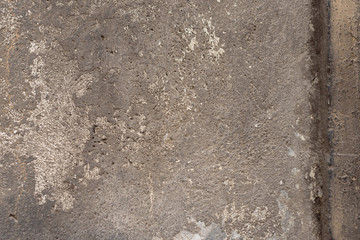 Wall fragment with scratches and cracks