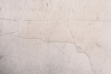 Wall fragment with scratches and cracks